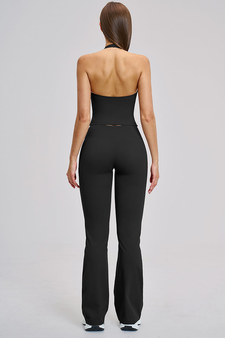 Women's two-piece athleisure workout set in black: back halter top and flared leggings