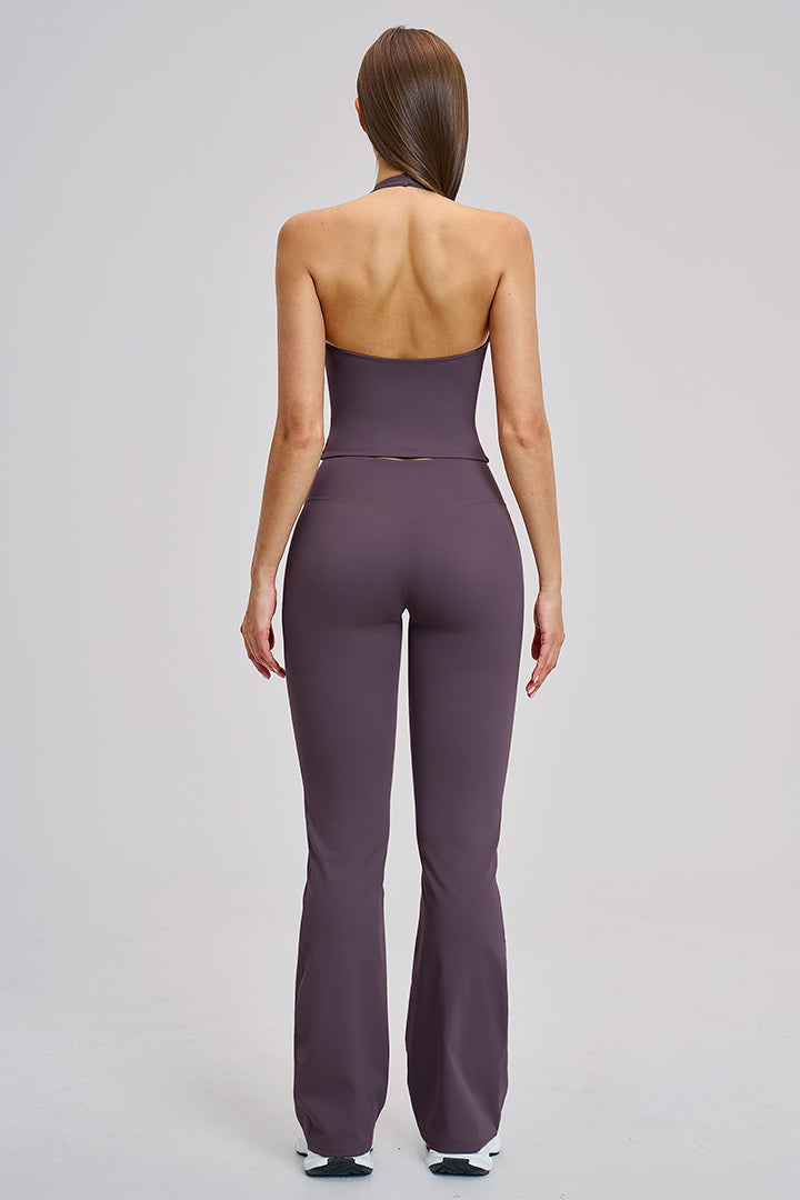 Women's two-piece athleisure workout set in purple: back halter top and flared leggings