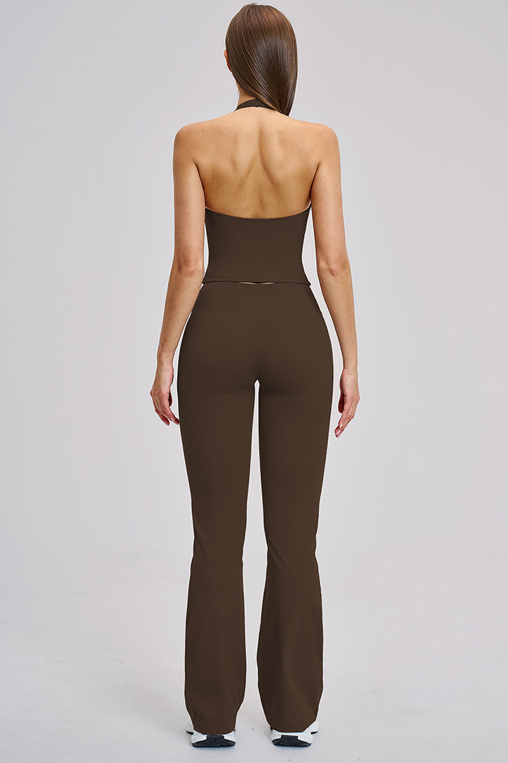 Women's athleisure set in brown: racerback crop top and flared high-rise leggings, back view.