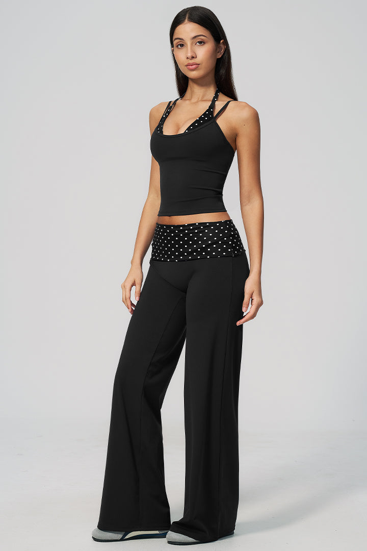 Black halter top and wide-leg pants with white polka-dot ruched waist band