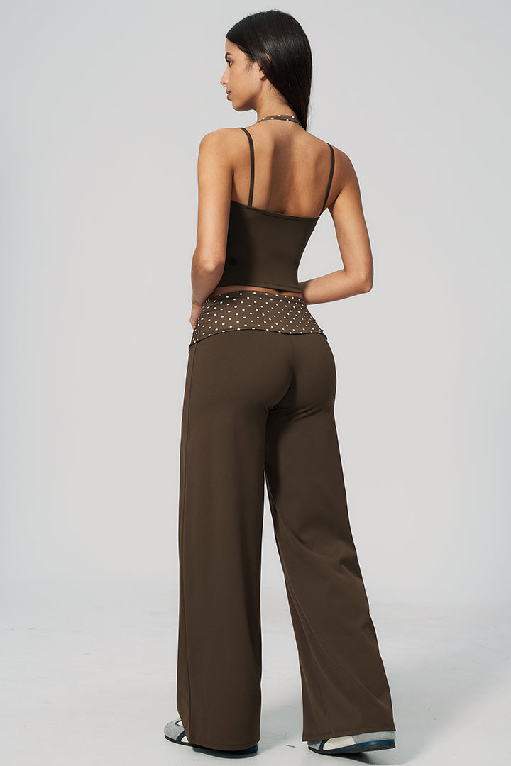 Side view of brown halter top and wide-leg pants set with dotted waist detail