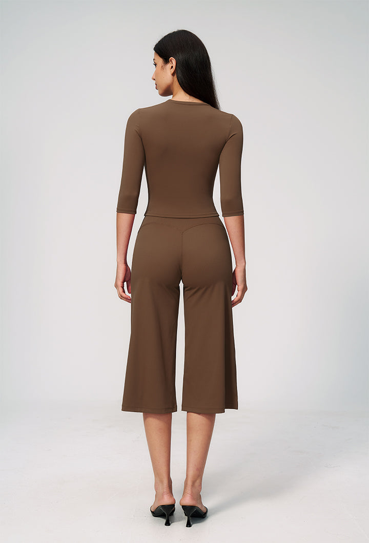 Women’s brown knit 2-piece set with fitted 3/4-sleeve top and wide-leg pants, back view