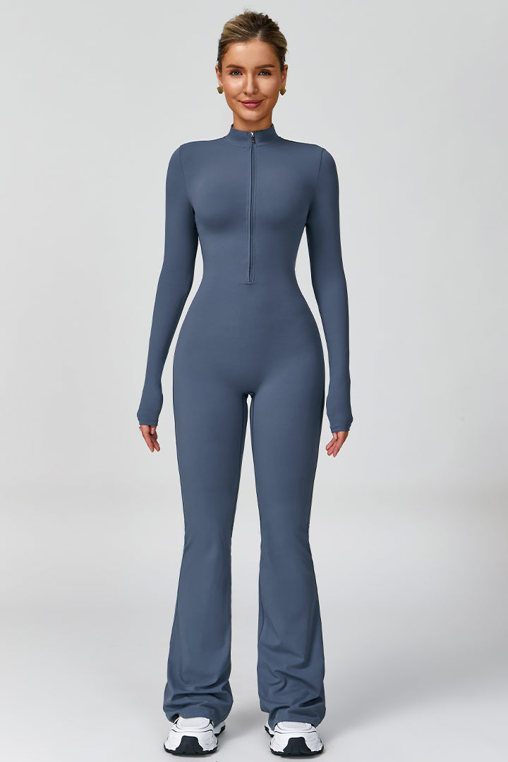 Blue women's long-sleeve sports jumpsuit with front zipper and flared pant legs