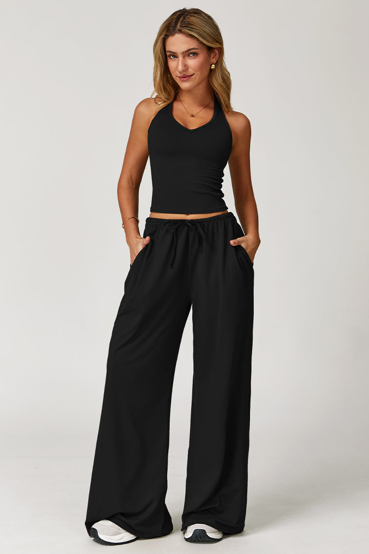 Black athleisure set with V-neck crop tank and wide-leg drawstring pants