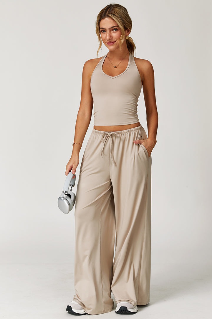 Beige 2-piece athleisure set, halter-style crop tank and wide-leg drawstring pants