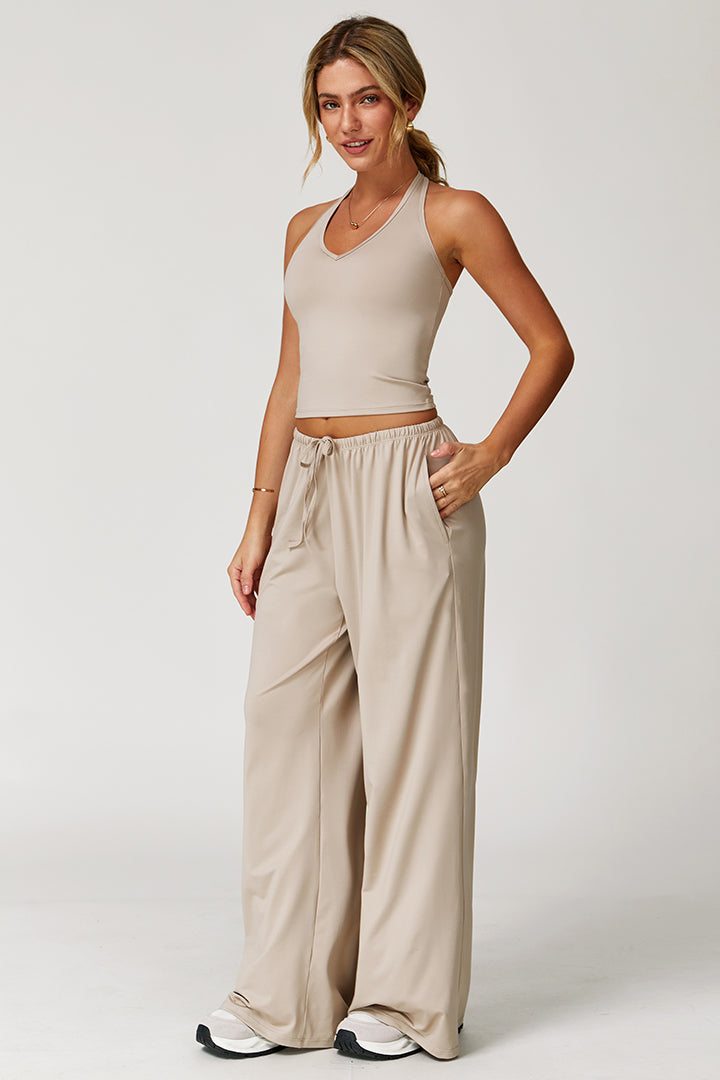 Cream two-piece athleisure set with cropped tank and wide-leg joggers