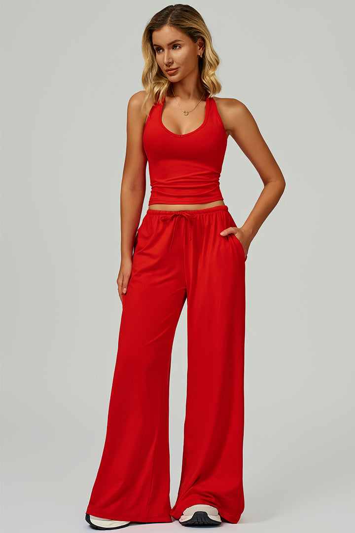 Red two-piece athleisure set with scoop-neck tank and drawstring wide-leg pants