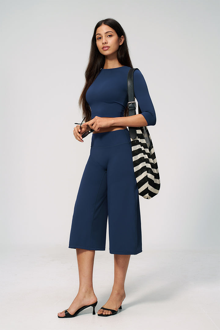 Blue crop top and wide-leg capri pants set with striped tote bag