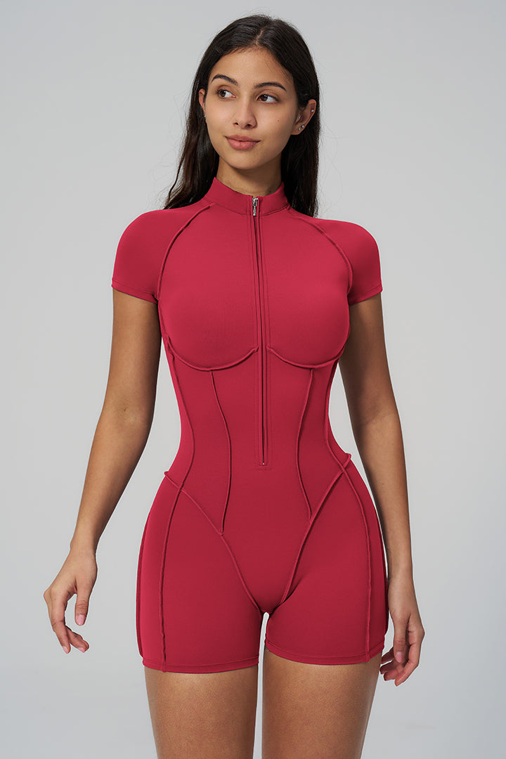 Red high-stretch sports jumpsuit with front zipper, short sleeves, and molded bust