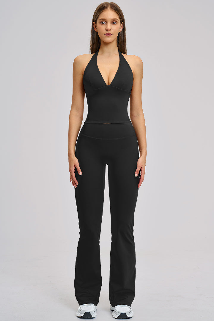 Women's two-piece athleisure workout set in black: halter V-neck tank and flared leggings