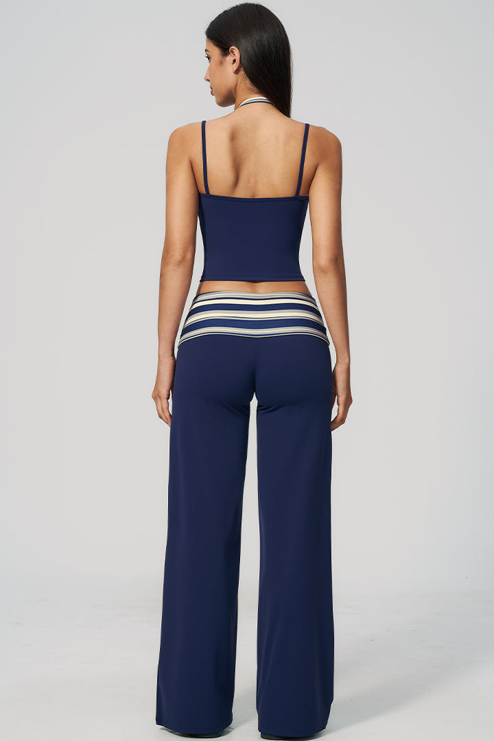 Back view of navy halter top and wide-leg pants set with striped waistband