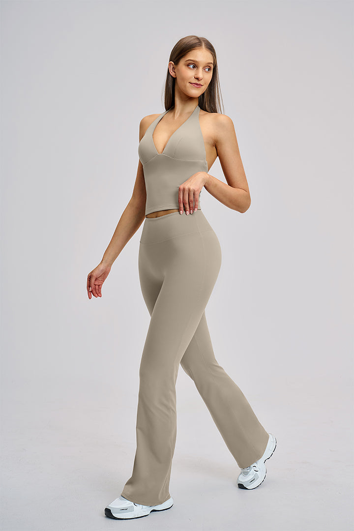 Women's two-piece athleisure workout set in gray: halter V-neck tank and flared leggings