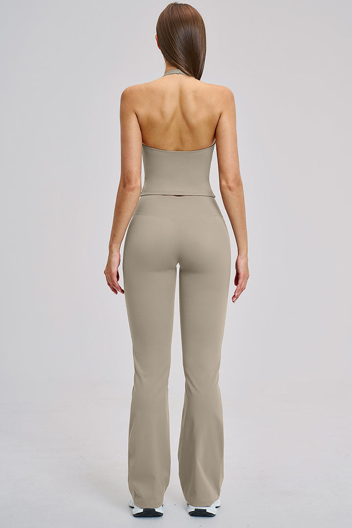 Women's two-piece athleisure workout set in light beige: halter tank and flared leggings