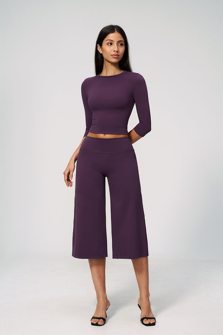 Purple two-piece set with long-sleeve cropped top and wide-leg capri pants