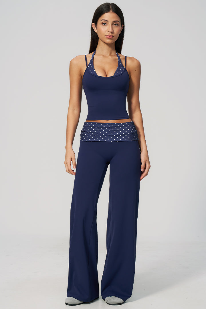 Navy halter top and wide-leg pants set with white polka-dot stripe at waist