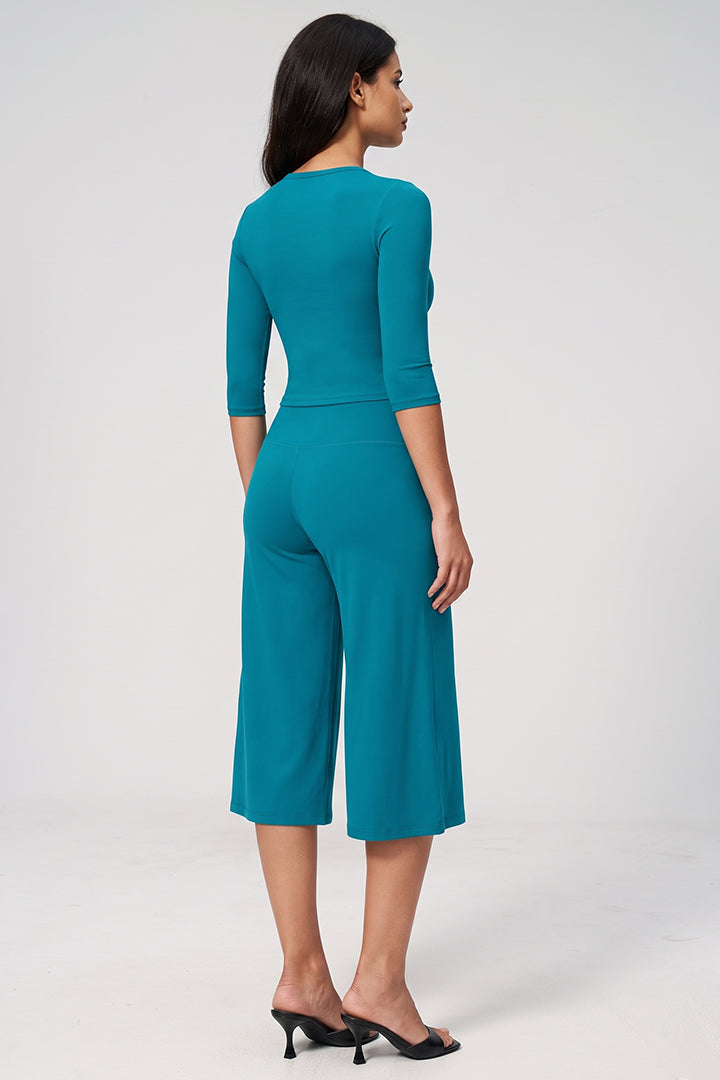 Peacock blue long-sleeve crop top and wide-leg culottes, back view 2-piece set
