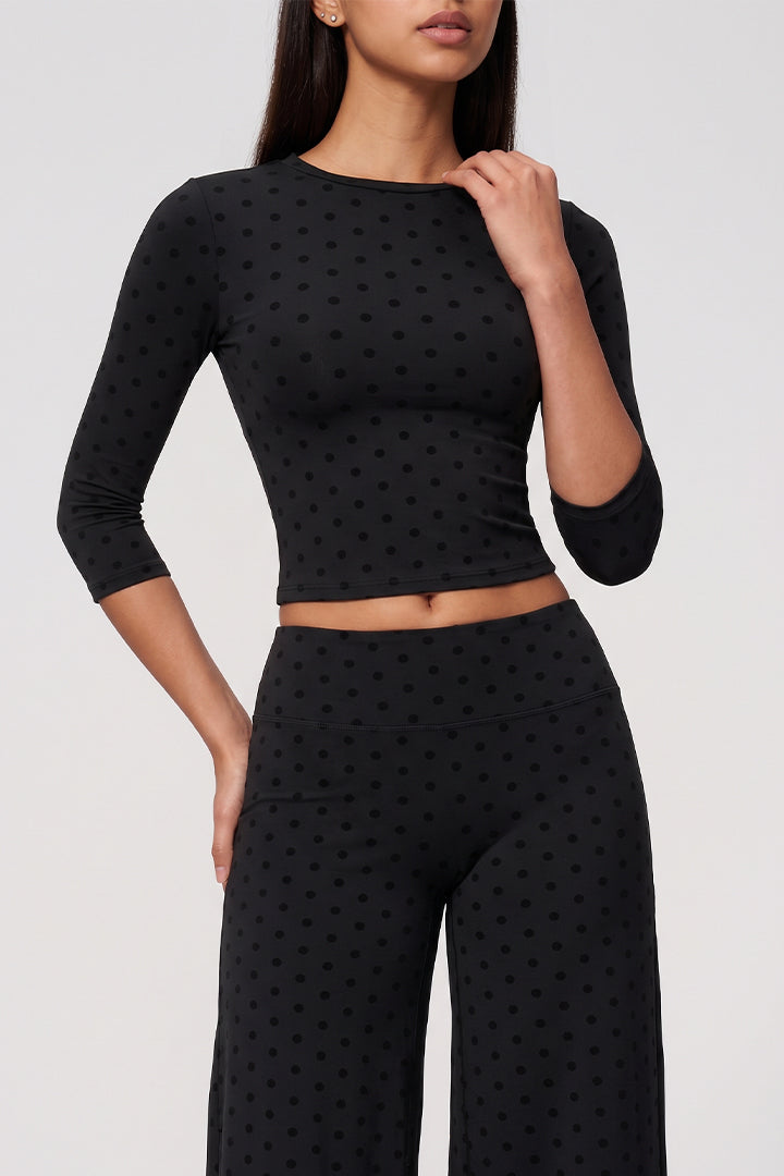 Black flocked polka-dot long-sleeve crop top and matching wide-leg culottes